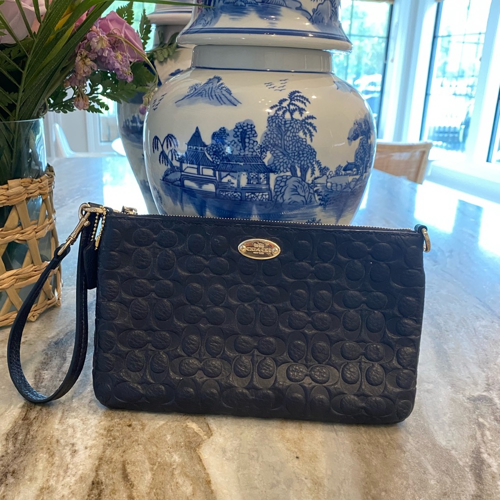 Navy Embossed logo Coach wristlet w/ pockets + light gold hardware